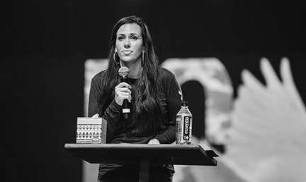 Jessica Koulianos preaching at UPPERROOM